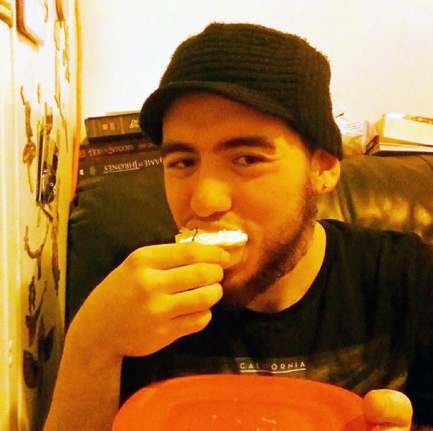 Eating a vanilla vegan cupcake. Beard or no beard, everyone should enjoy a cupcake with a smile.