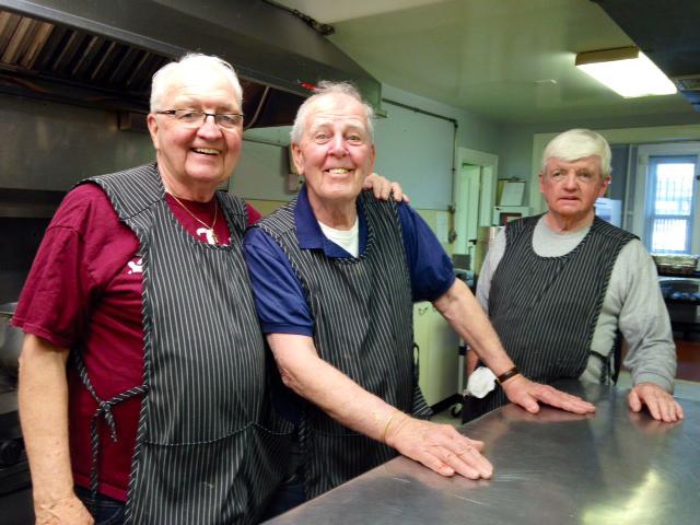 From left to right: St. Johns Parish Manager Vincent Smith, Tuesday Crew volunteer Buddy McNulty, and John McGlinchy