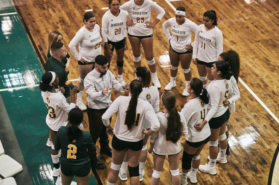 Coach Justin Beaumont and the Women's  Volleyball Team last season. 