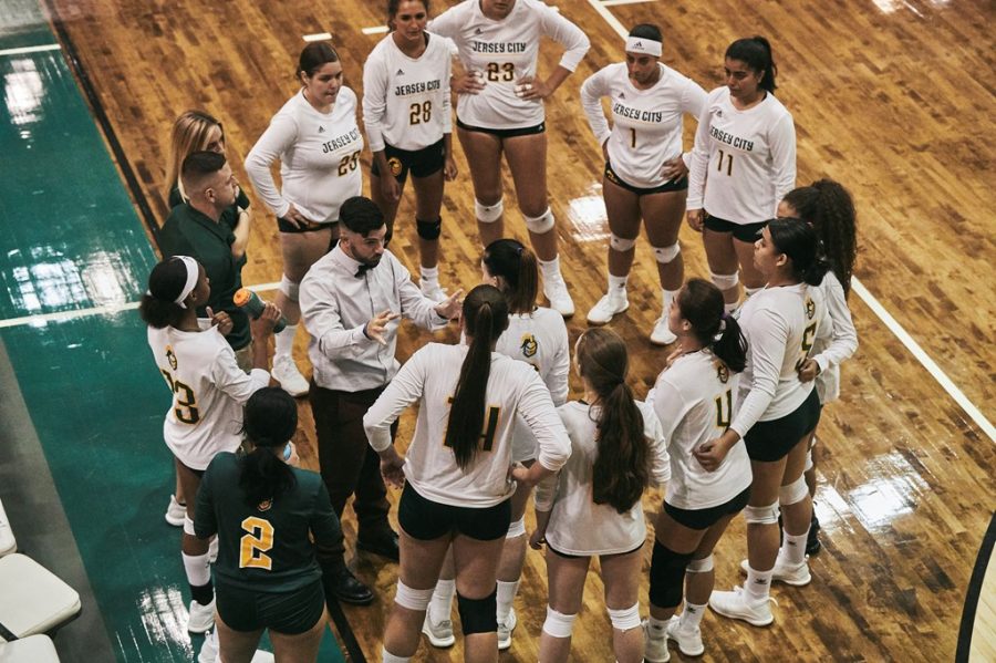 Coach Justin Beaumont and the Womens  Volleyball Team last season. 