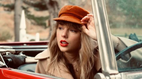 A photo of Taylor Swift from the photoshoot for the album cover of Red (Taylors Version). Photo Credit: Beth Garrabrant 