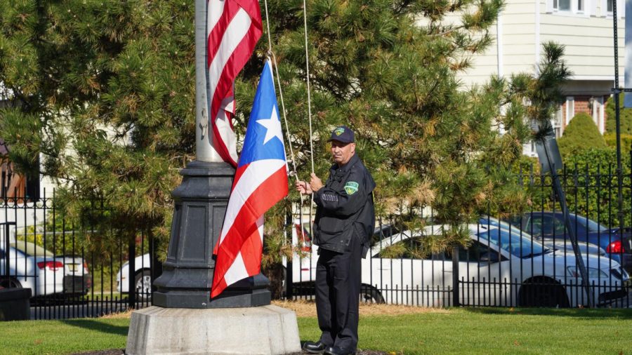 Raising of the Puerto Rican flag in front of Hepburn Hall. Photo by David Wilson. 