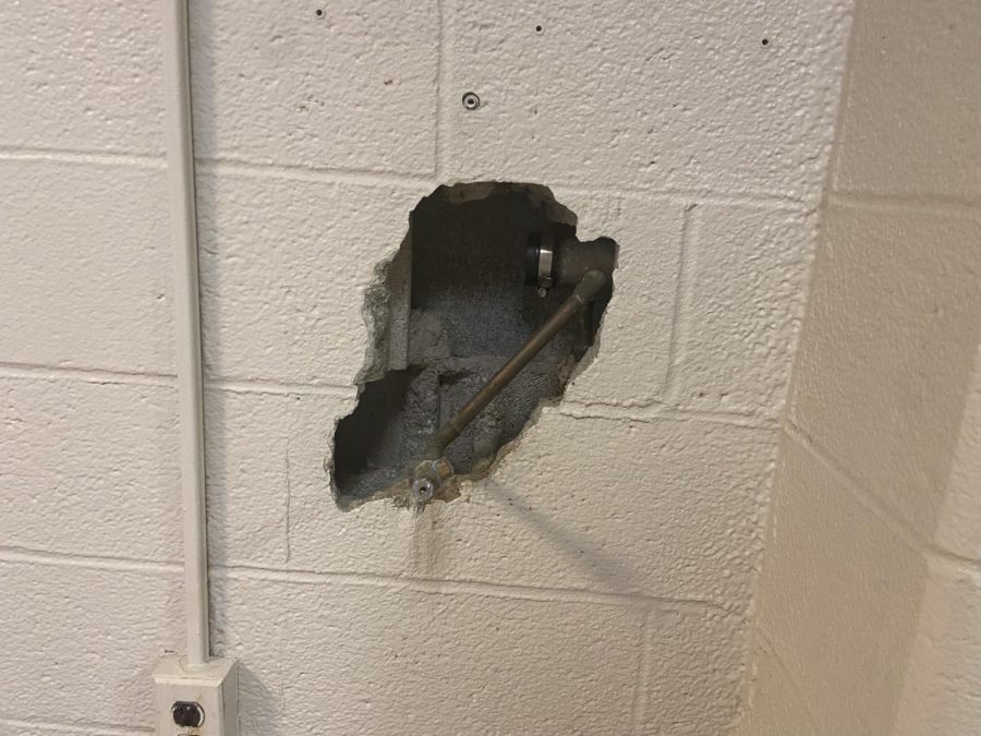 A hole in the wall of Grossnickle Hall. 