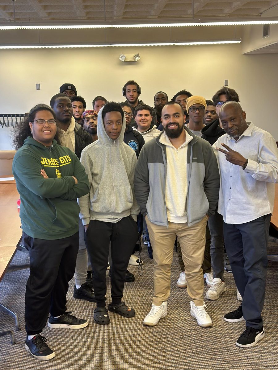 NJCU alumn Eduardo Alay (second-to-right) speaks about financial literacy during one of MOCI’s weekly meetings